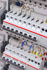 Automatic current switches to protect electrical loads. Soft focus.