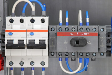 Automatic current switches to protect electrical loads. Soft focus.