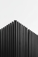 Fototapeta premium 黒い木材の立てられた構造物の上部が白い空に向かって伸びる様子