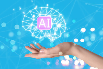 Artificial intelligence. Woman holding virtual brain with AI abbreviation on light blue background,...