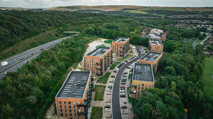 Aerial view of newly build housing estate with solar panels on top roof.