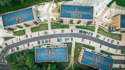 Aerial view of newly build housing estate with solar panels on top roof.