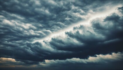 Fototapeta premium Mystic clouds loom over a deep sky, evoking a sense of wonder.