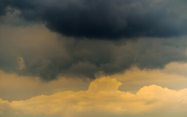 Dark thunder clouds over cumulus