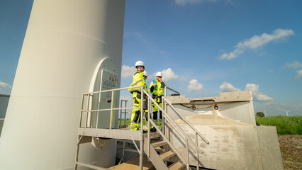 A group of  workers in high-visibility gear joyfully high-fives each other after completing their...
