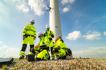 A group of  workers in high-visibility gear joyfully high-fives each other after completing their...