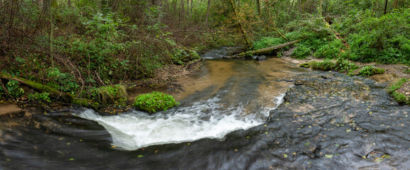 Rocky threshold on the wild, small river Sopot. Panoramic view of small water cascade, autumn....