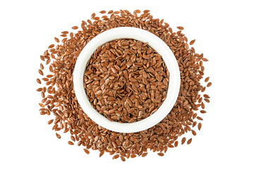 flaxseed in ceramic bowl isolated on white background. Top view. Flat lay