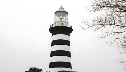 Discover the charm of lighthouse architecture with black and white stripes merging with the ocean.
