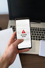 Wildfire notification appearing on the phone while in use. Vertical shot.
