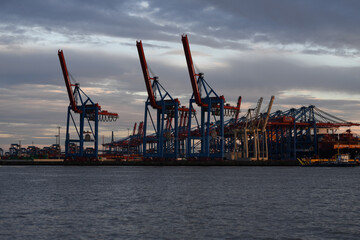 Container terminal in the port. Terminal port. Container cargo ship in a commercial dock. New York container port. Ship container port. Industrial background.