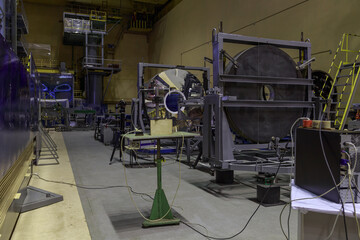 A reflector mirror for an astronomical telescope in a factory workshop.