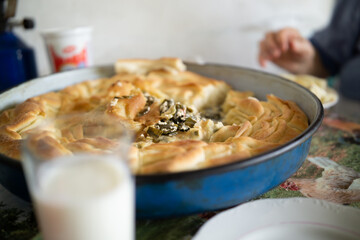 Close up of grandma's hands eating traditional homemade pie