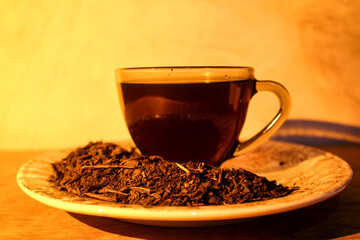 A hot cup of tea in a quiet, low-lit room.