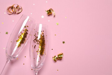 Festive background with champagne glasses and confetti