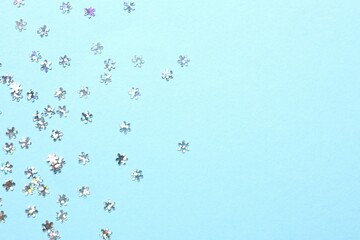 Beautiful silver confetti on a color background