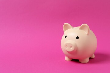 Piggy coin bank on color background for money savings, financial security or personal funds concept