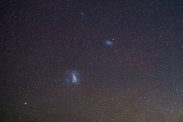 Fototapeta premium Stargazing at the celestial night sky and magellanic clouds
