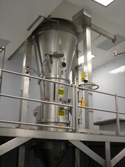 Industrial Stainless Steel Fluid Bed Dryer System with Safety Features in a Pharmaceutical Facility