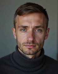 Obraz premium A young man from Russia gazes directly at the viewer with striking blue eyes. Tousled hair and relaxed expression. Introspection and tranquility. Portrait of a handsome man of 30 years. Generative AI