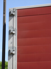 Close-Up of Red Industrial Door with Steel Frame