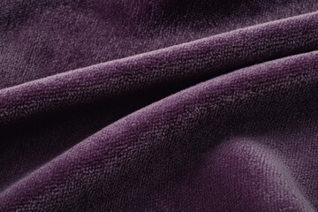 Fototapeta premium Smooth velvet fabric texture, deep purple tones with a soft, luxurious sheen, elegant and tactile