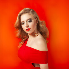 Glamorous Woman in Red Dress with Beauty Makeup
