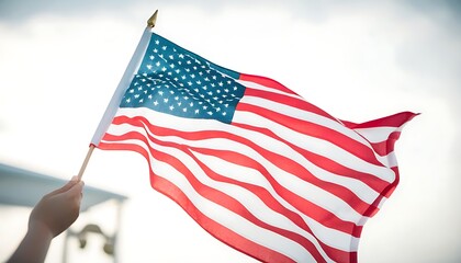Obraz premium American flag in hand, celebrating Independence Day atmosphere