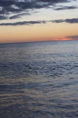 Obraz premium sunset over the ocean evening on sea with small waves