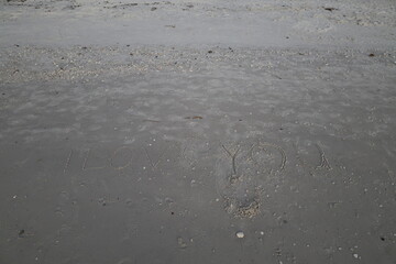 Love you sign on beach sand