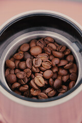 A Detailed Close-Up View Of Roasted Coffee Beans Inside A Metal Grinder. Perfect For Highlighting...