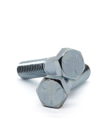 Two zinc plated, grade 5 bolts stacked on a white back ground.