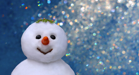 Snowman close-up on New Year's background of colored lights 
