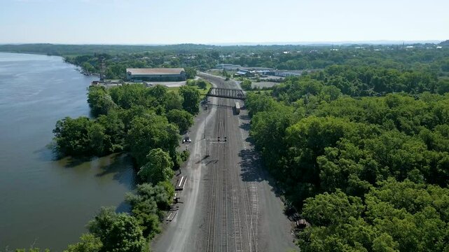 Aerial view of abandoned waterfront industrial building on the Hudson River, drone 4K