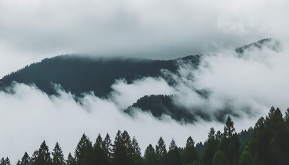 A view of mountains topped with clouds, embracing natural beauty