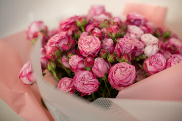 A close-up of a vibrant bouquet of pink roses, showcasing their delicate petals and natural beauty. Perfect for themes of love, romance, celebrations, or floral arrangements.