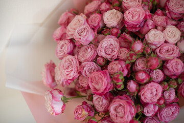 A close-up of a vibrant bouquet of pink roses, showcasing their delicate petals and natural beauty. Perfect for themes of love, romance, celebrations, or floral arrangements.