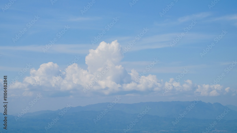 Fototapete abstract shapes, patterns and textures of white clouds clustered against the blue sky. natural white
