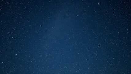 Fototapeta premium A starry night sky with a few stars visible
