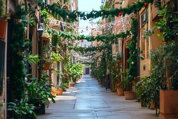 Narrow street beautifully decorated with Christmas garlands and potted plants on a sunny day