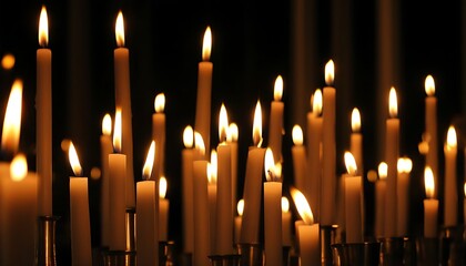 A serene world of candles in the deep night, with flicking flame and warm harmony.
