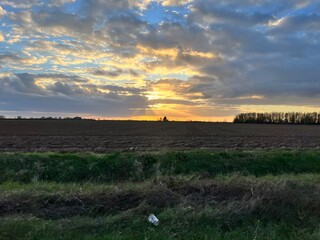 cloudy sunset over the field