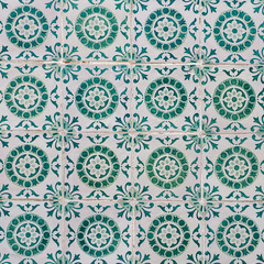 Fragment of building wall with colorful ceramic wall tiles, Azulejo close up. Abstract decorative background, textured ornate pattern for design or backdrop. Traditional ornate Portuguese architecture