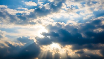 Obraz premium Mystical and breathtaking world of clouds behind the sun, a dreamlike skyscape.