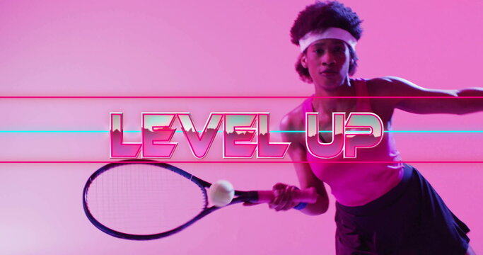 Level up text image over person holding tennis racket on pink background
