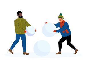 Friends creating snowballs during a winter day in a snowy landscape