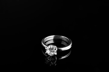 Beautiful bijouterie. Stylish ring on black background