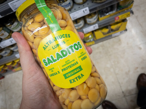 VALENCIA, SPAIN - OCTOBER 13, 2024: close-up shot of a jar of lupins, sweet lupin beans, or altramuces or tremocos, for sale in a supermarket in Valencia, highlighting their role in Spanish cuisine.