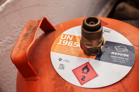 VALENCIA, SPAIN - OCTOBER 13, 2024: close-up of a butane gas canister labeled UN1965 in Valencia, Spain, emphasizing the importance of safety and regulation in handling hazardous materials in energy s