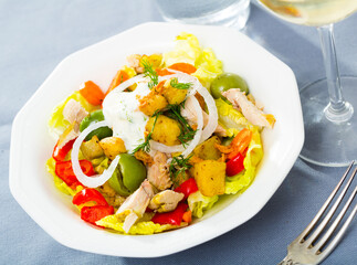 Healthy salad with grilled chicken breast, aubergines, peppers, onion and greens